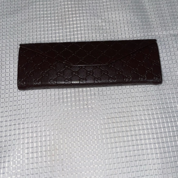 brown leather monogrammed foldable eyeglasses case from Gucci. - Picture 10 of 16